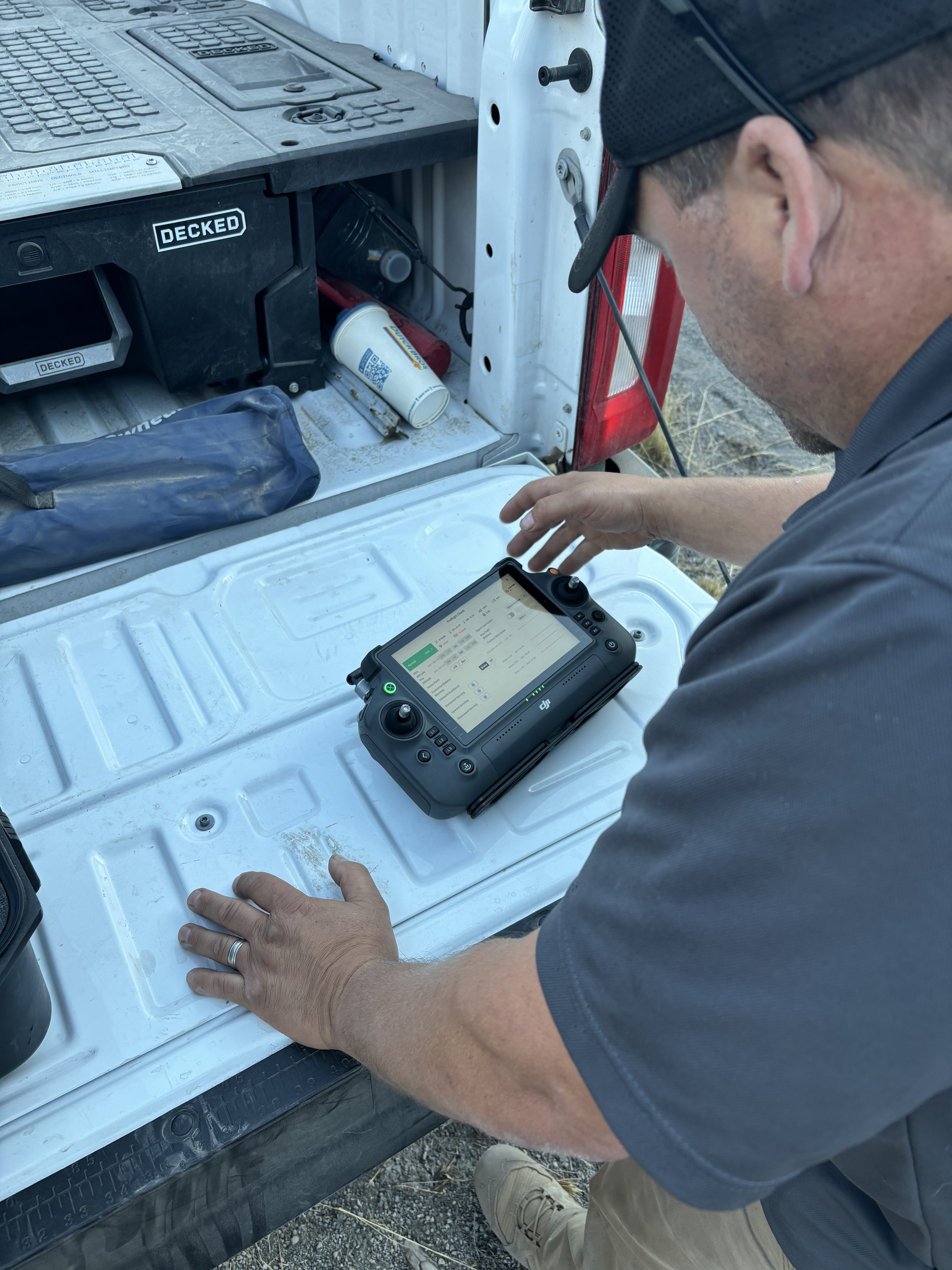 Attendees learn how to utilize drones to haze wolves during a field outing while in Oregon attending wolf-livestock conflict training.